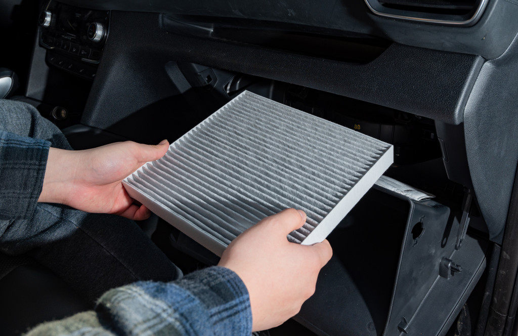 changing-air-filter-inside-car-car-maintenance.jpg